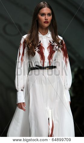 ZAGREB, CROATIA - MAY 09: Fashion model wearing clothes designed by Avaro Figlio on the Zagreb Fashion Week on May 09, 2014 in Zagreb, Croatia.