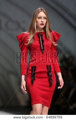 ZAGREB, CROATIA - MAY 09: Fashion model wearing clothes designed by Avaro Figlio on the Zagreb Fashion Week on May 09, 2014 in Zagreb, Croatia.