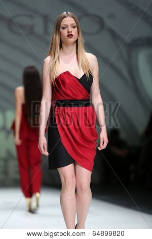 ZAGREB, CROATIA - MAY 09: Fashion model wearing clothes designed by Avaro Figlio on the Zagreb Fashion Week on May 09, 2014 in Zagreb, Croatia.