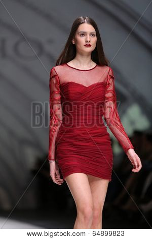 ZAGREB, CROATIA - MAY 09: Fashion model wearing clothes designed by Avaro Figlio on the Zagreb Fashion Week on May 09, 2014 in Zagreb, Croatia.