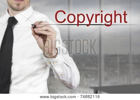 Businessman Writing Copyright In The Air