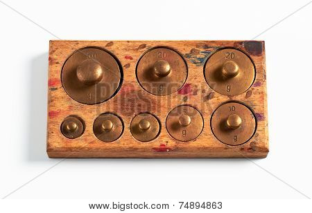 Old Brass Metric Weights In A Tray Of Wood