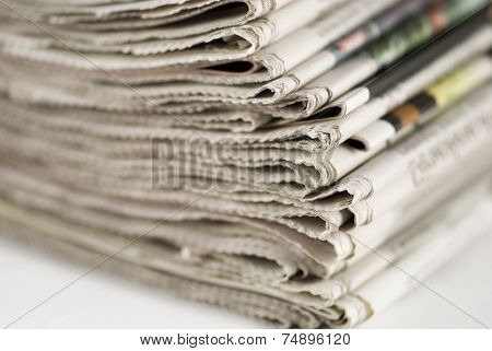 newspapers stack on white background