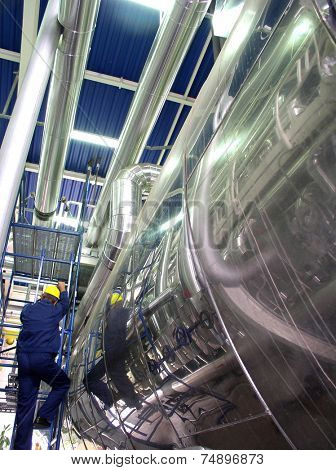 Worker inside modern power plant