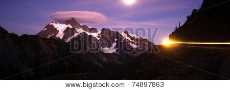 Lone Car Passes On Roadway Full Moon Mt Shuksan
