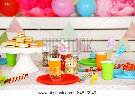 Prepared birthday table with sweets for children party