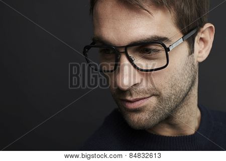 Mid adult man wearing glasses studio shot