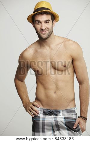 Portrait of mid adult man in shorts and hat