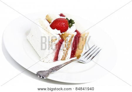 Strawberry cream cake on a white background with small shadow