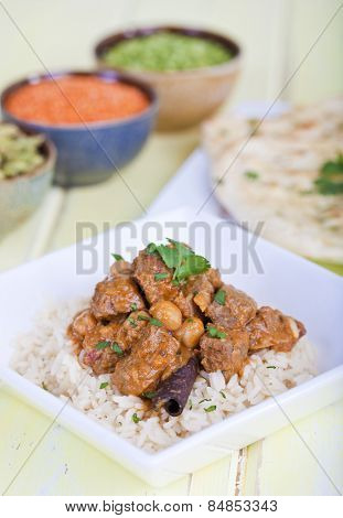 Beef curry served on a bed of rice