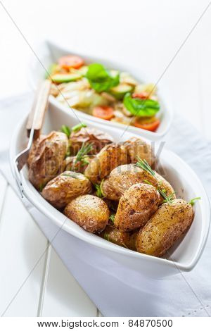 Rustic oven baked potatoes with cabbage salad