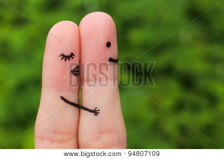 Finger art of a Happy couple. Girl a hug and kisses the boy.