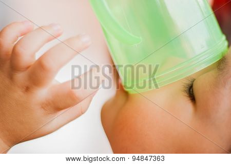 A boy is drinking.