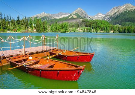 Red boats and Tatra Mountains high peaks, Slovakia