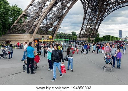 Tourists Near The Eiffel Tower, Main Attraction Of Paris