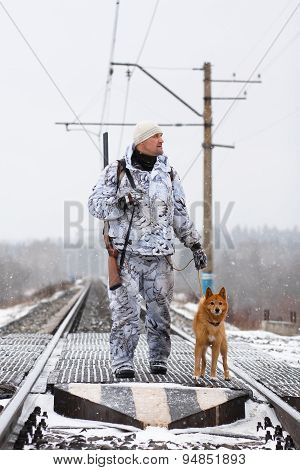 The Hunter With Dog On The Railroad Crossing