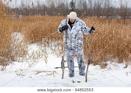 Hunter Putting A Trap For Beaver