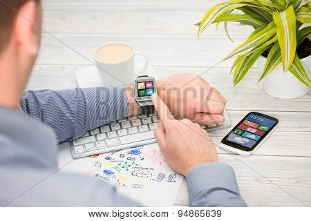 Businessman Uses Smart Watch And Phone.