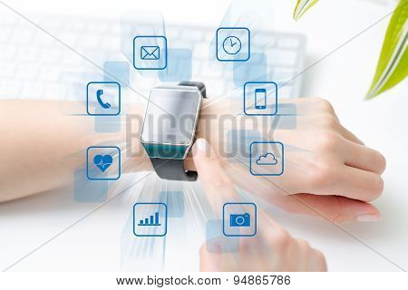 Wearing Touchscreen Smartwatch With App Icons.