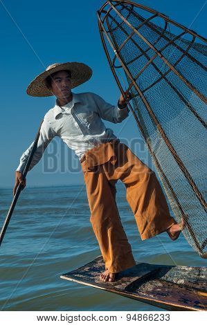Burmese Fisherman Catching Fish In Traditional Way. Inle Lake, Myanmar