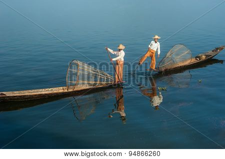 Burmese Fisherman Catching Fish In Traditional Way. Inle Lake, Myanmar