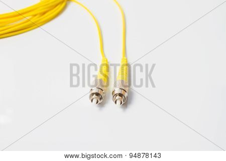 Close up of a fiber optic patchcord on white background