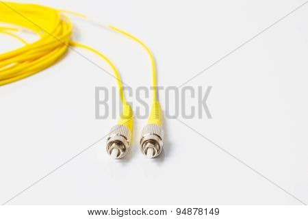 Close up of a fiber optic patchcord on white background