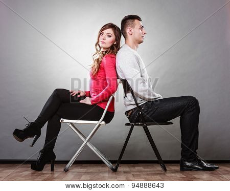 Unhappy Couple Sitting Back To Back. Disagreement.