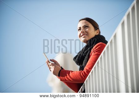 Smiling Woman On A Terrace
