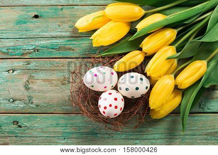 Easter Background Yellow Tulips On Wooden Table, Rabbit, Eggs,nest Candy