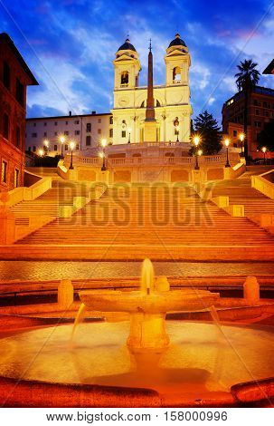 Spanish Steps with boat fountain illuminated at night, Rome, Italy, retro toned