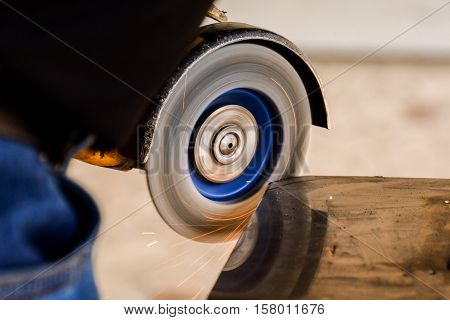 Cutting Steel With Angle Grinder At Car Service