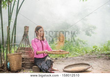 Beautiful Thai Asian Women Winnow Rice Separate Between Rice And Rice Chaff Identity . In Traditiona