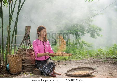 Beautiful Thai Asian Women Winnow Rice Separate Between Rice And Rice Chaff Identity . In Traditiona