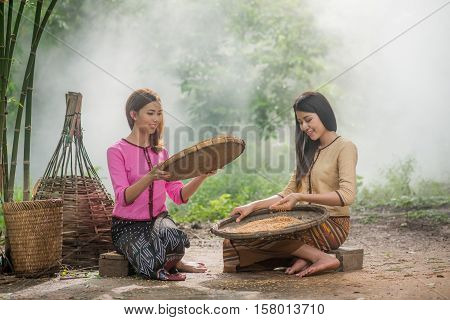Beautiful Thai Asian Women Winnow Rice Separate Between Rice And Rice Chaff Identity . In Traditiona