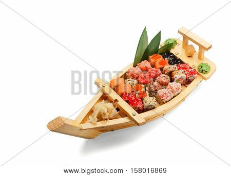 Japanese Cuisine. Sushi Set In A Boat Isolated On White Bacground.