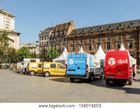 STRASBOURG FRANCE - CIRCA 2016: CHRONOPOST DPD and La Poste delivery vans in center of the city. Chronopost and DPD is part of French group La poste