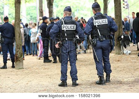 Paris, France - July 14, 2014: French Police Patrol (crs) Assigned To The Surveillance. These Troops