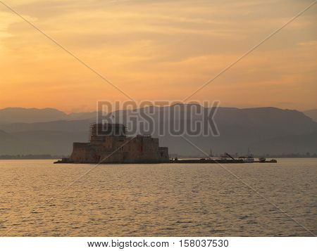 Medieval fortress on the sea under the twilight sky, Nafplion of Greece