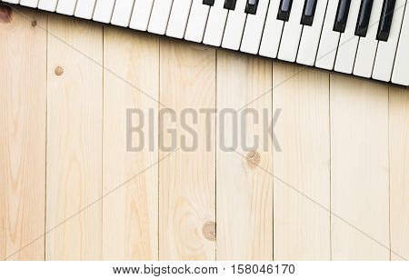 Music background copy space with piano keys on top.
