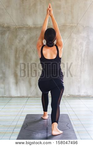 fitness sport training yoga and people concept - smiling woman doing exercise in gym