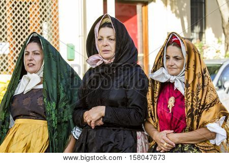 QUARTU S.E., ITALY - September 17, 2016: Parade of Sardinian costumes and floats for the grape festival in honor of the celebration of St. Helena. - Sardinia - group of women in traditional Sardinian costumes