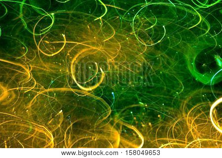Photo by yellow-green light-graffiti curlicue for background.