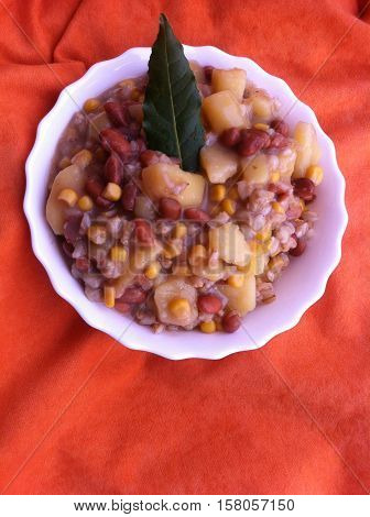 a bowl with beans, corn, and patatoes