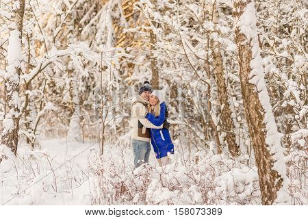 The Guy And The Girl Have A Rest In The Winter Woods.