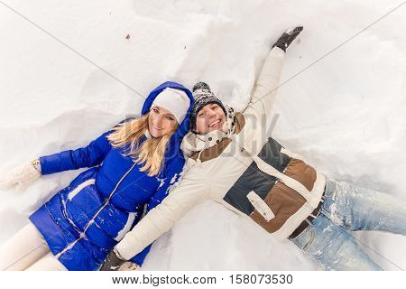 The Guy And The Girl Have A Rest In The Winter Woods.