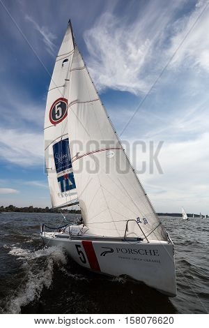 Kiev, Ukraine - September 30, 2016: Sailing yacht training day. Day before race on the Kiev reservoir or pond