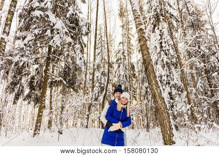 The Guy And The Girl Have A Rest In The Winter Woods.