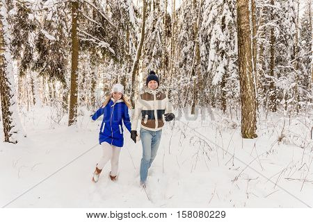 The Guy And The Girl Have A Rest In The Winter Woods.