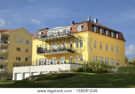 Nynashamn - a view of a colorful buildings on a public park. Nynashamn is located far south in Sodertorn, 58 kilometers south of Stockholm.